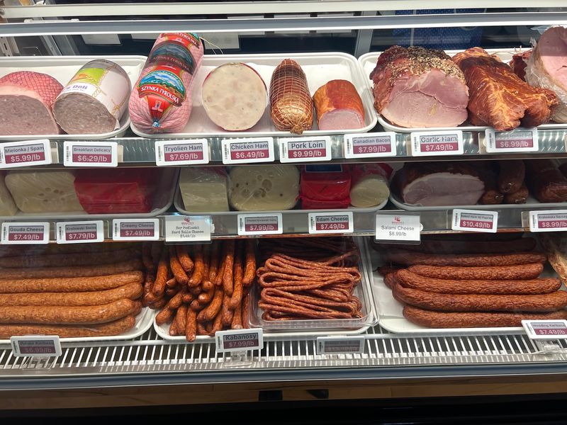 A Deli Case Full Of Meats And Cheeses