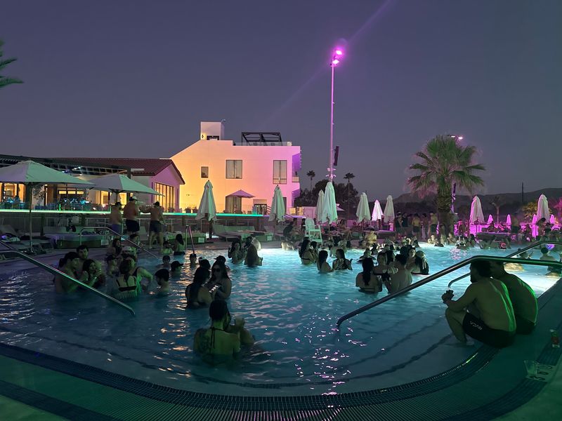 This California Surf Park Hosts A 21+ Night Swim With DJs And After-Hours Water Fun - Decor Hint Dance Beside The Island Pool While DJs Take Over