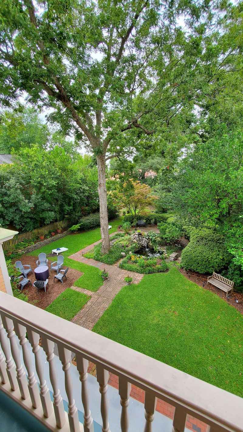 Relax In The Backyard Beside The Fire Pit And Water Garden