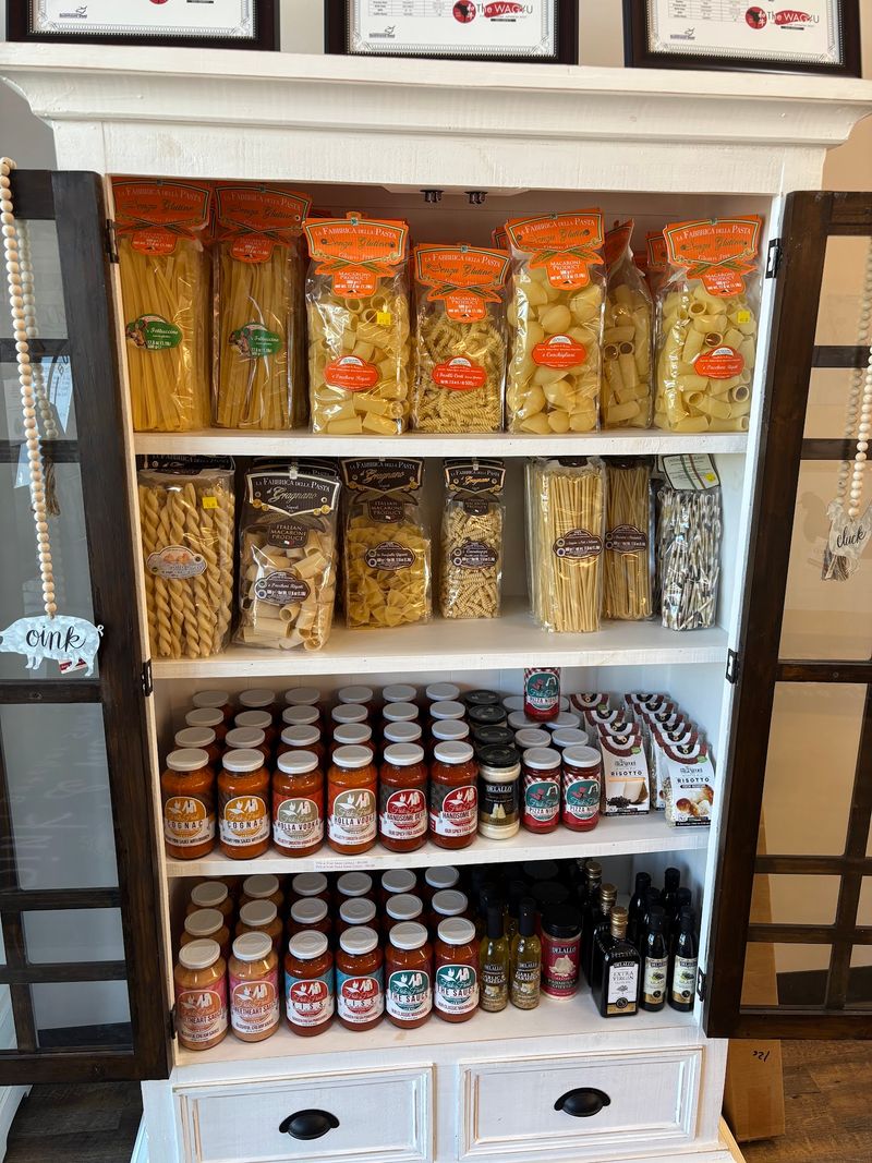 Shelves Full Of Cheeses And Pantry Finds