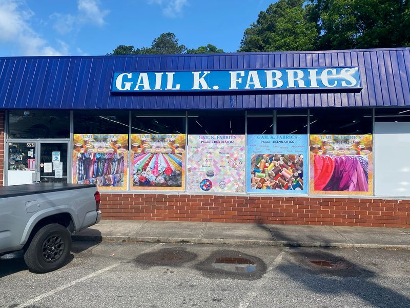 A Brick Storefront With A Blue Awning