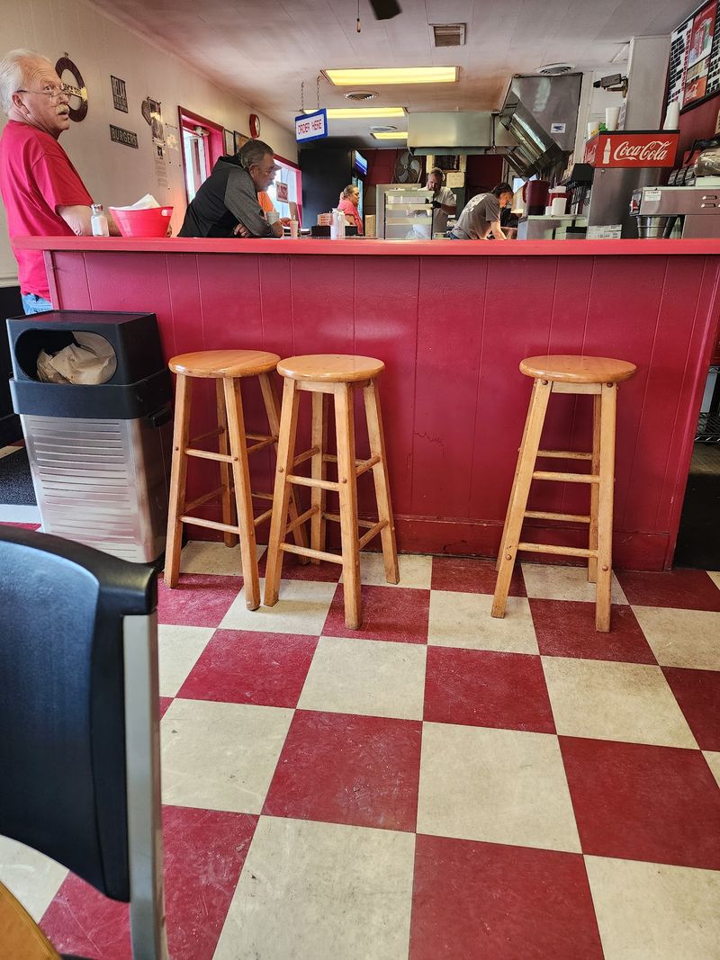 A Simple Space With Red Walls And Marquee Letters