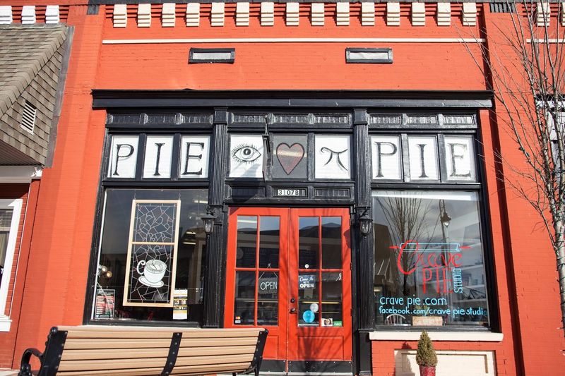 A Coral-Red Storefront That Refuses To Be Ignored