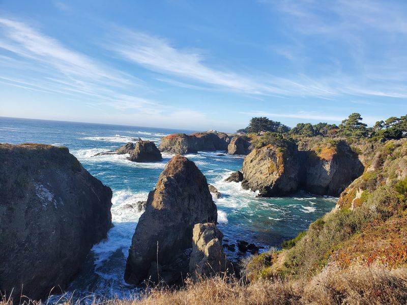 Watch The Waves Break Against Sculpted Coastal Rocks