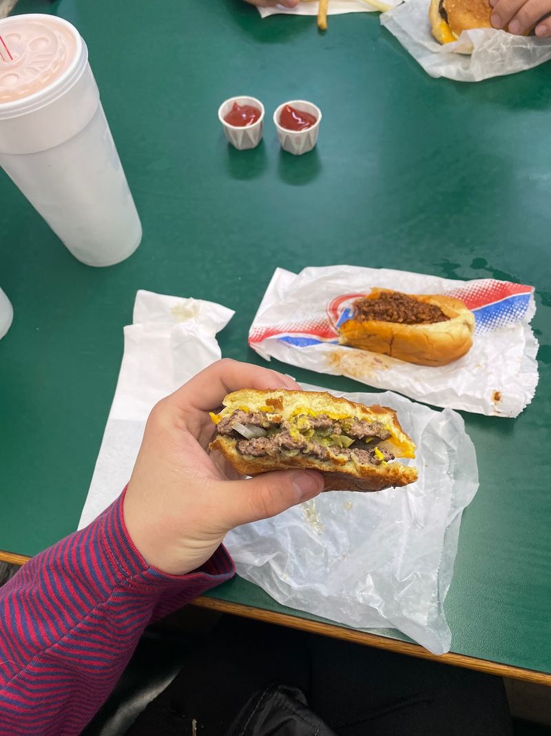 That First Bite Of An Old-School Flame-Grilled Burger