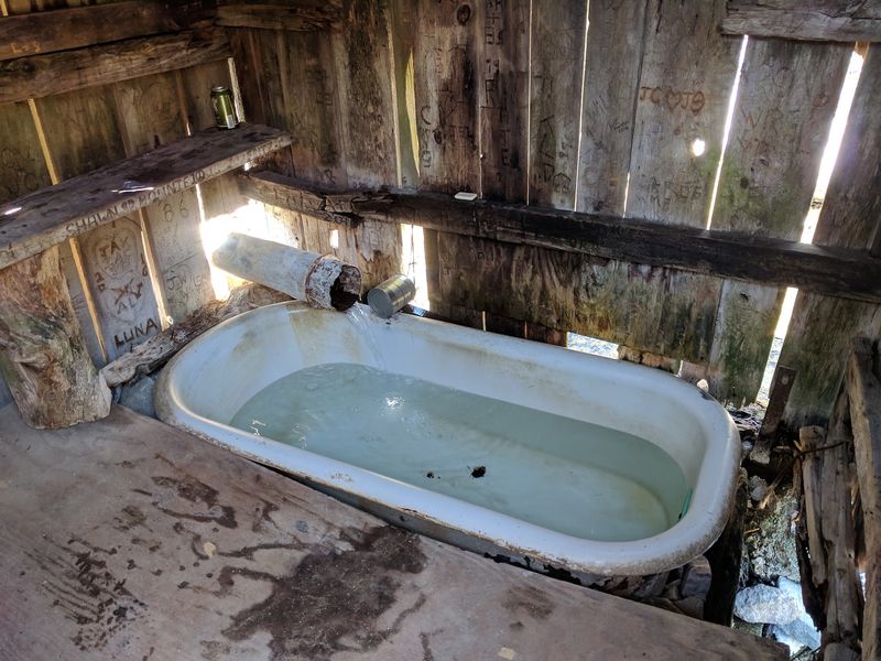Inside, An Old Cast-Iron Bathtub Fills With Naturally Hot Geothermal Water
