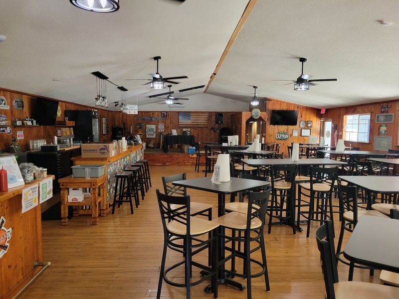 Once You Taste Its Seafood Buffet, This Florida Riverside Restaurant Ruins Every Other Buffet - Decor Hint Wood Paneling, Counter Seats, and a Patio