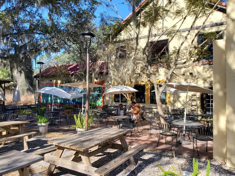 This Central Florida Country Bakery Is Packed With Homemade Food Worth The Road Trip - Decor Hint Shaded Biergarten Seating With Weekend Live Music