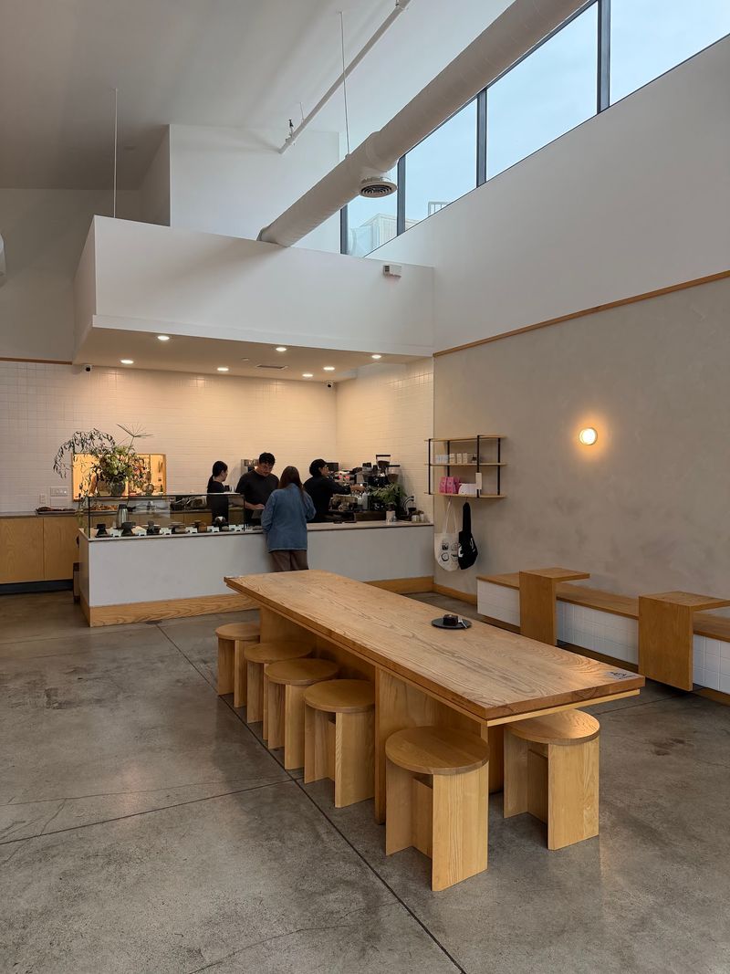 Inside The Bright, Minimal Room With A Long Wooden Table