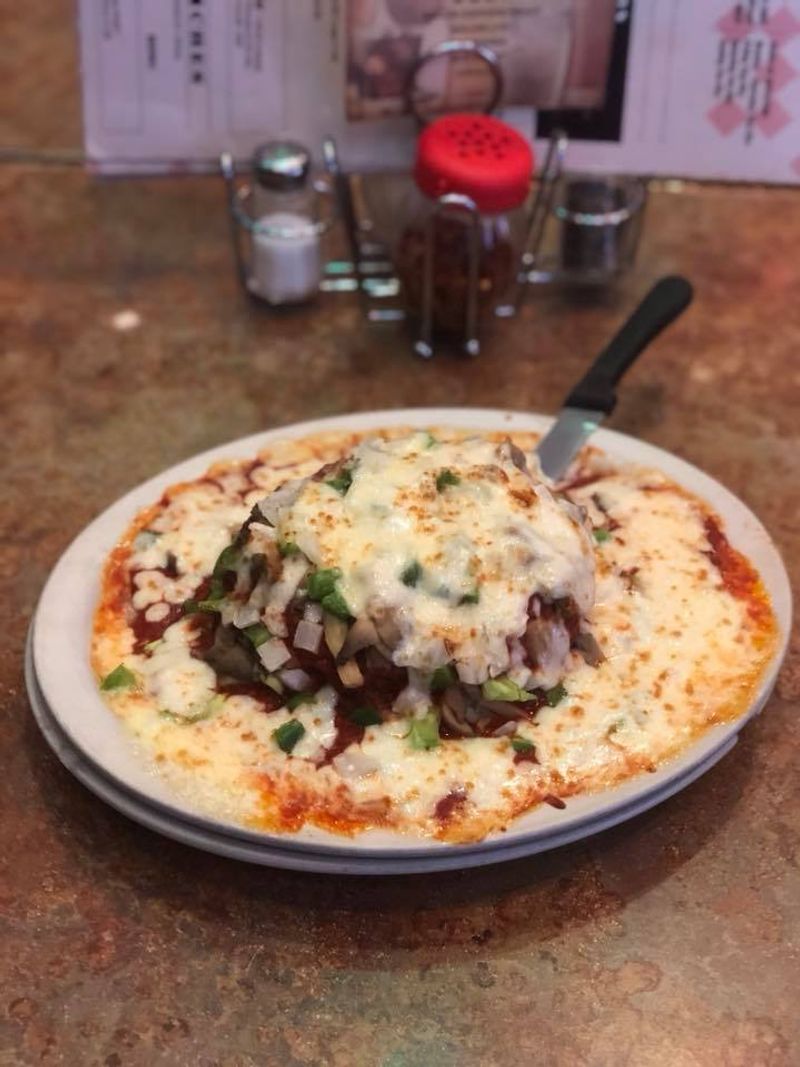 Incredible Pepperoni Pizza Is Hiding Inside This Unassuming Minnesota Italian Restaurant - Decor Hint Cheese Pellets And Gooey Science