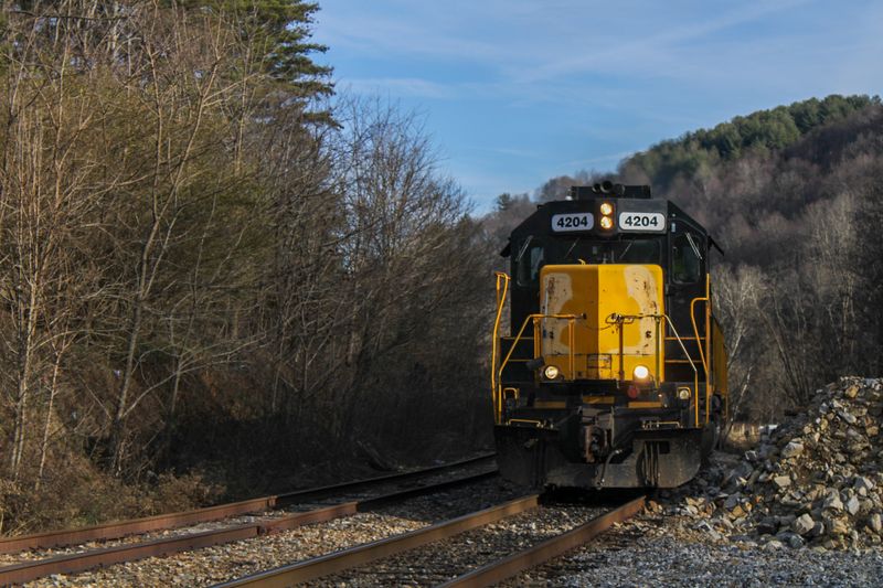 Watch For Its Black-And-Yellow Locomotives Around Mountain Towns
