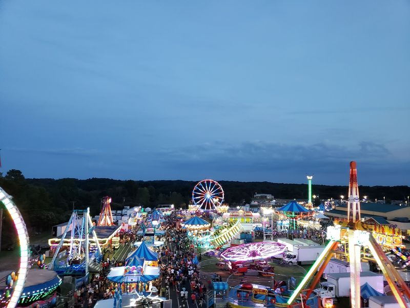 Midway Rides Keep The Fairgrounds Glowing Well Into The Evening