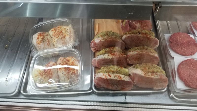 Cheeses And Cured Meats Fill The Deli Selection