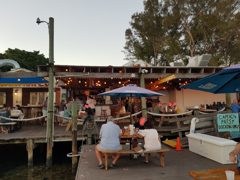 Locals Drive An Hour For The Smoked Mullet At This Florida Fishing Village Smokehouse - Decor Hint The Verdict on a Dock with a Kitchen
