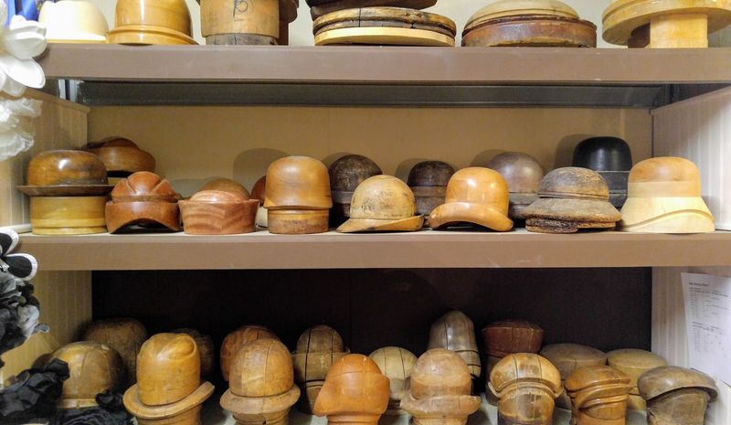 Michelle Obama, Oprah And Madonna Have All Worn Hats From This Kentucky Shop - Decor Hint Antique Wooden Hat Blocks And Vintage Tools On Display