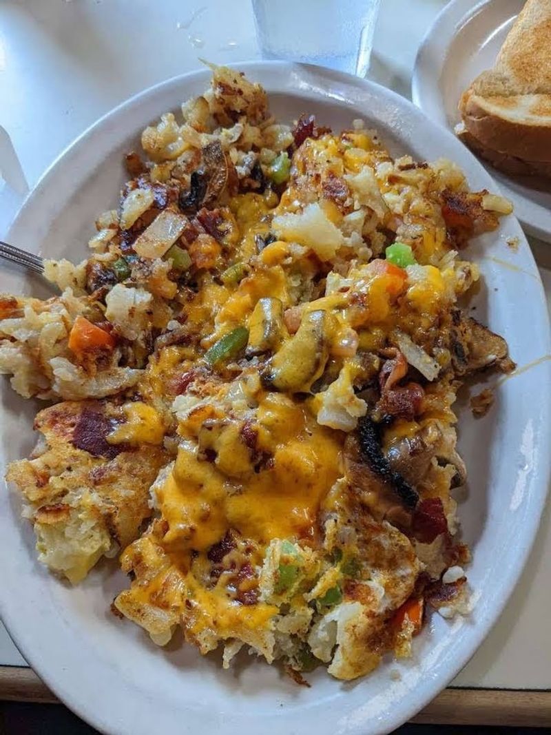 The Meat Lovers Hash Browns Arrive Buried Under Three Kinds Of Meat