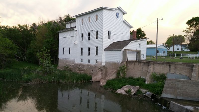 A Three-Story Frame Mill on the Edge of the Water