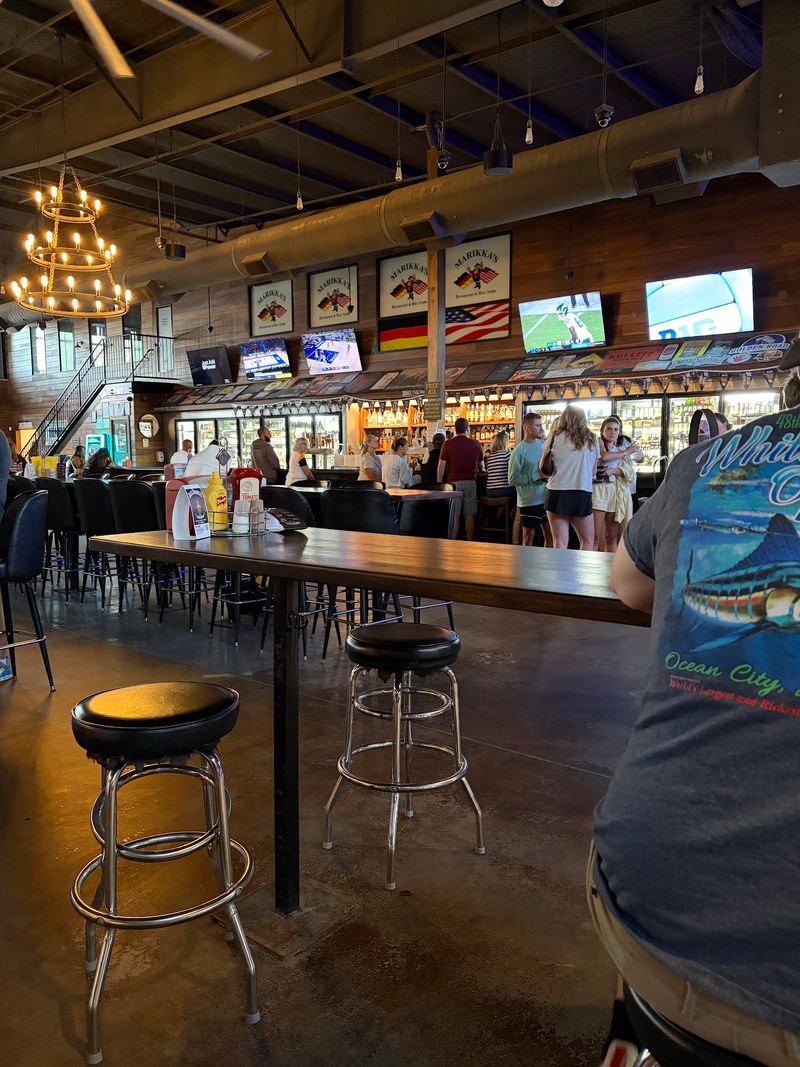This Kentucky German Restaurant Has Been Serving Old-World Favorites For Decades And Oktoberfest Is Its Biggest Party - Decor Hint Dark Wood, Crests, And Checkered Banners Overhead
