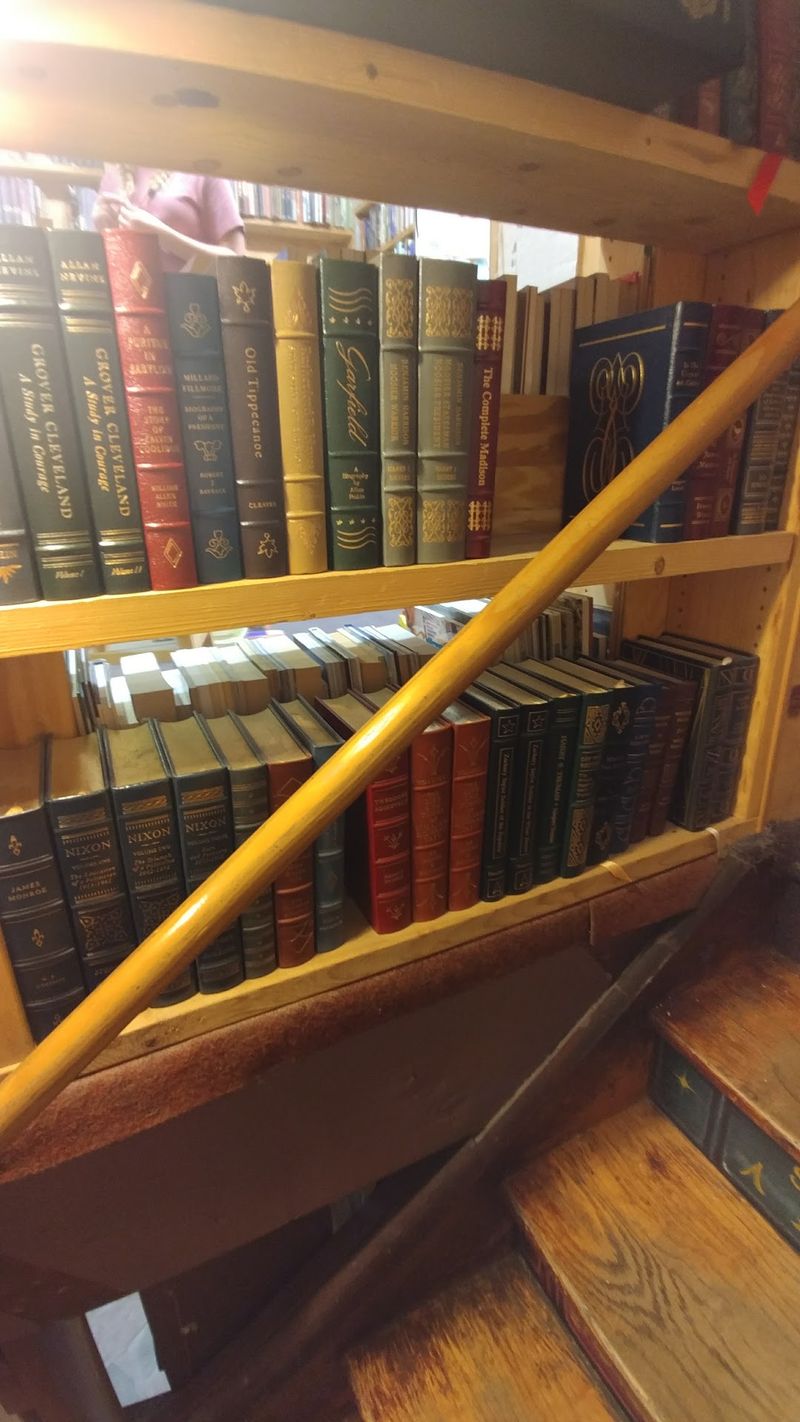 Weathered Paperbacks Beside Leather-Bound Finds