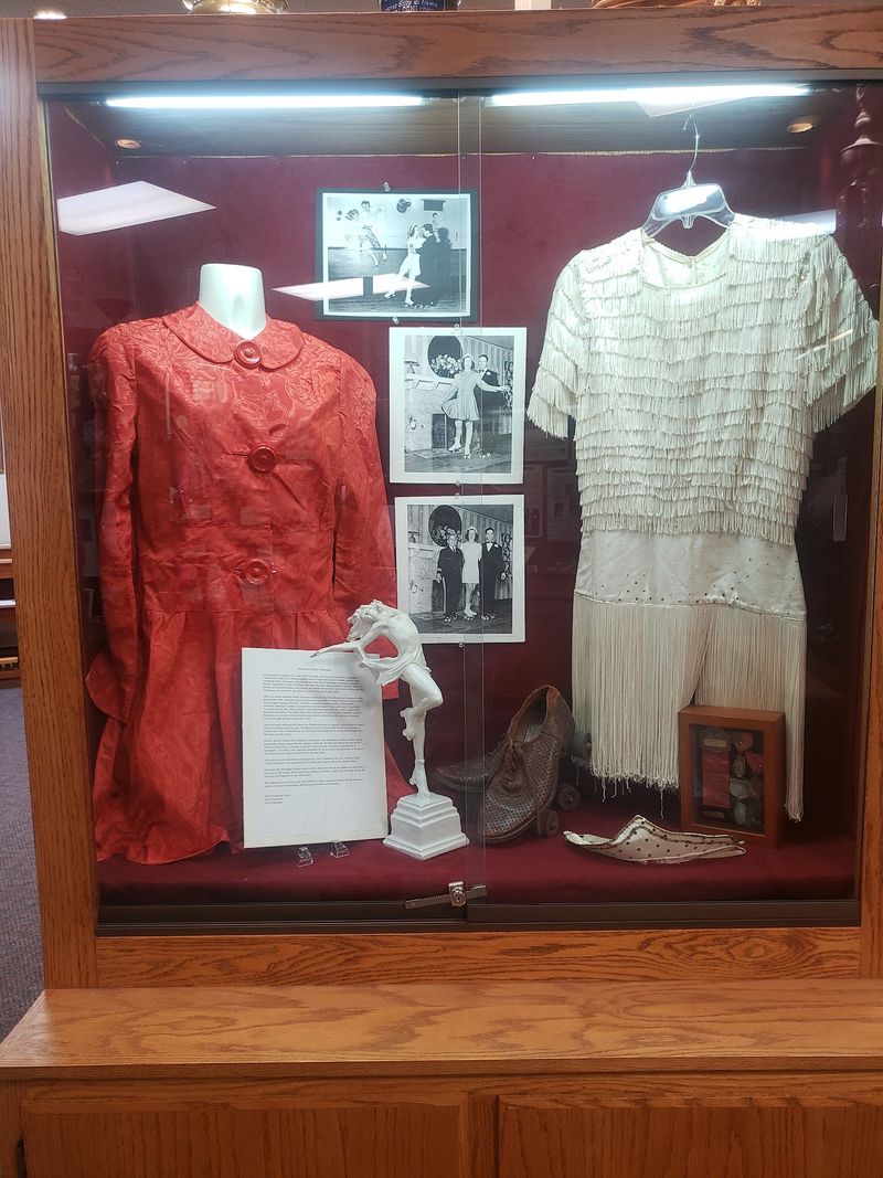 Sequins, Uniforms, and a Wall of Old Photographs