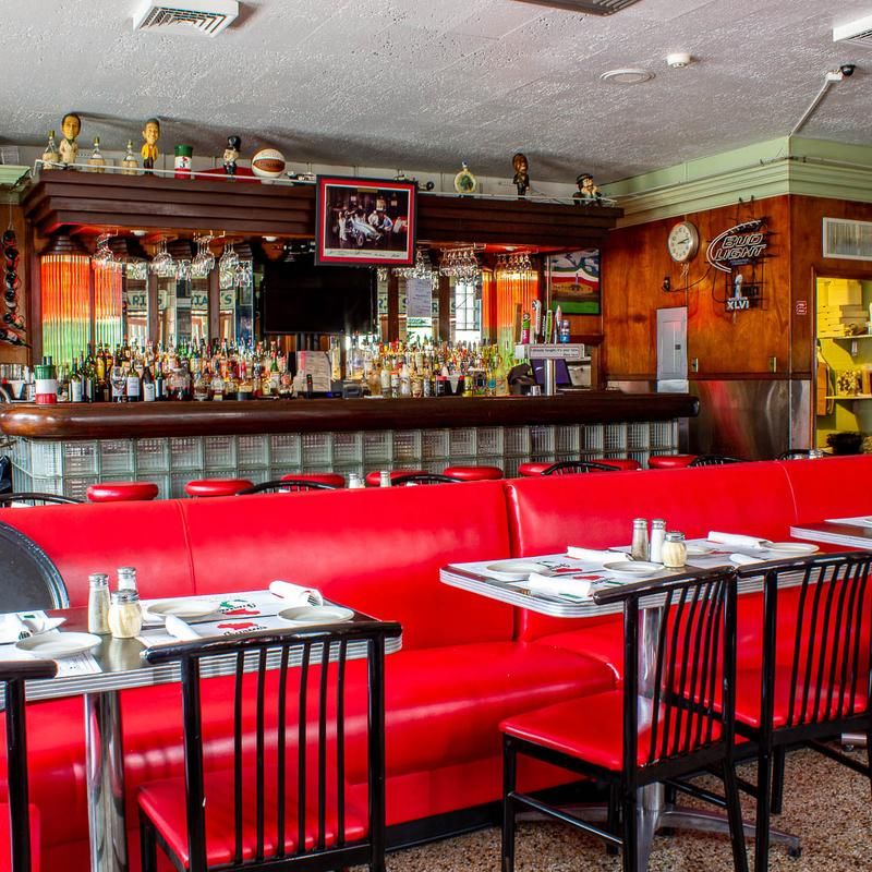 Red Booths And Neon Glow