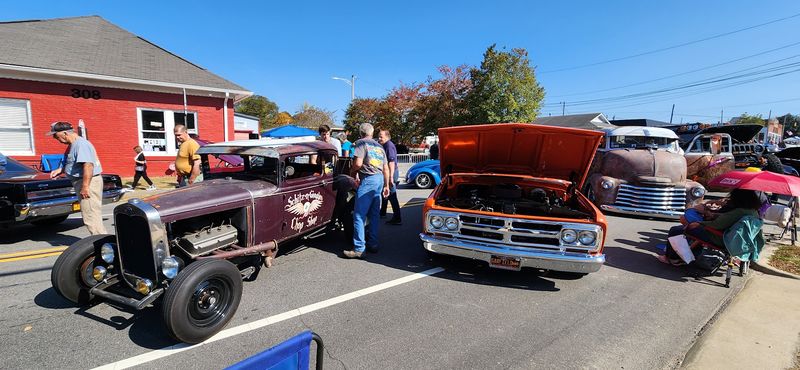 Classic Cars And Motorcycles Line The Downtown Blocks