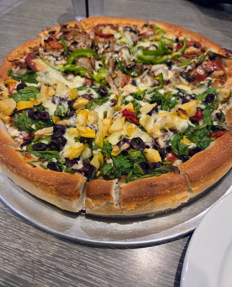 This Old-School Georgia Restaurant Has Been Serving Its Famous Greek-Style Pizza Since 1977 - Decor Hint The Athens Special Makes A Big Entrance