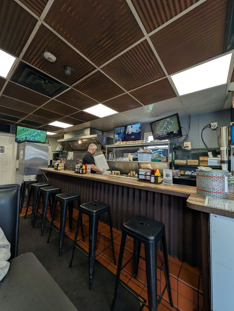 This 67-Year-Old Connecticut Burger Spot Was Just Named Home To The Best Cheeseburger In The State - Decor Hint Nearly Seven Decades Of Tradition Fill The Tiny Restaurant