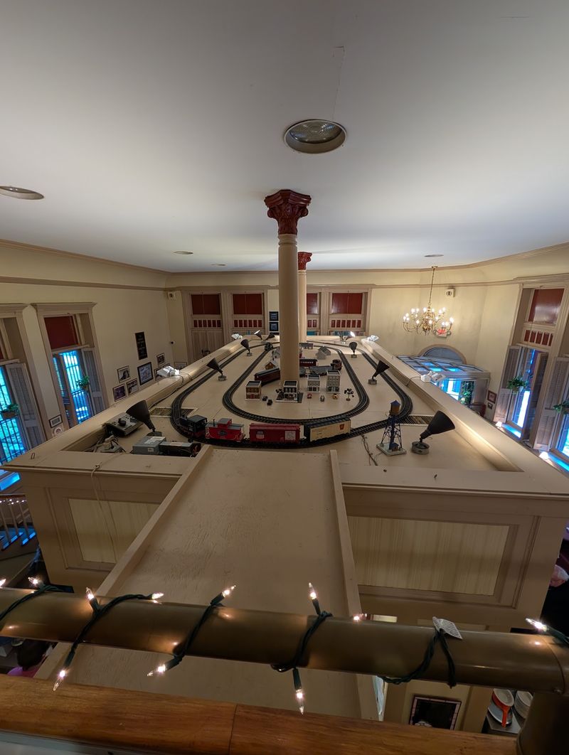 Model Trains Circling Above The Tables