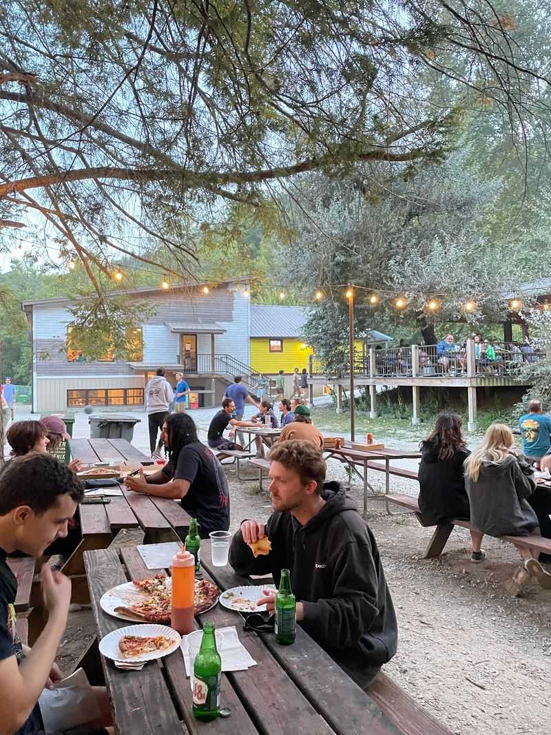 This Quirky Kentucky Community Has Barely 100 Residents, Endless Trails, Legendary Pizza, And A Lot Of Charm - Decor Hint School Bus Seats And Stories Around Every Table