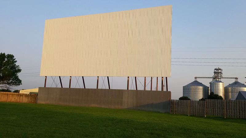 This Old-School Nebraska Drive-In Still Shows New Releases On A Single Outdoor Screen - Decor Hint A White Screen Above a Highway Field