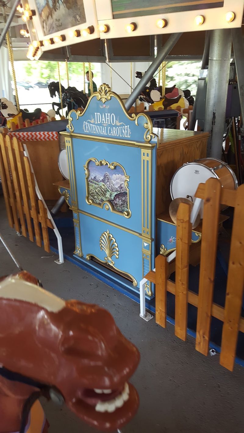 Hand-Carved Wooden Horses Still Circle On The Restored 1920s Idaho Centennial Carousel In Rexburg - Decor Hint Music From Paper Scrolls