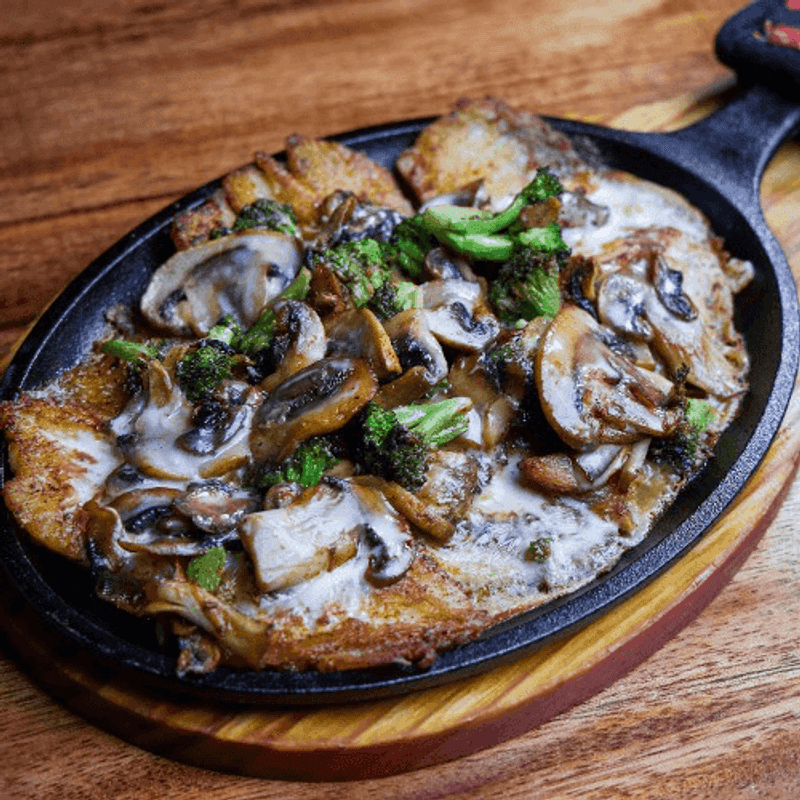 The Molcajete Patrona Arrives Still Sizzling