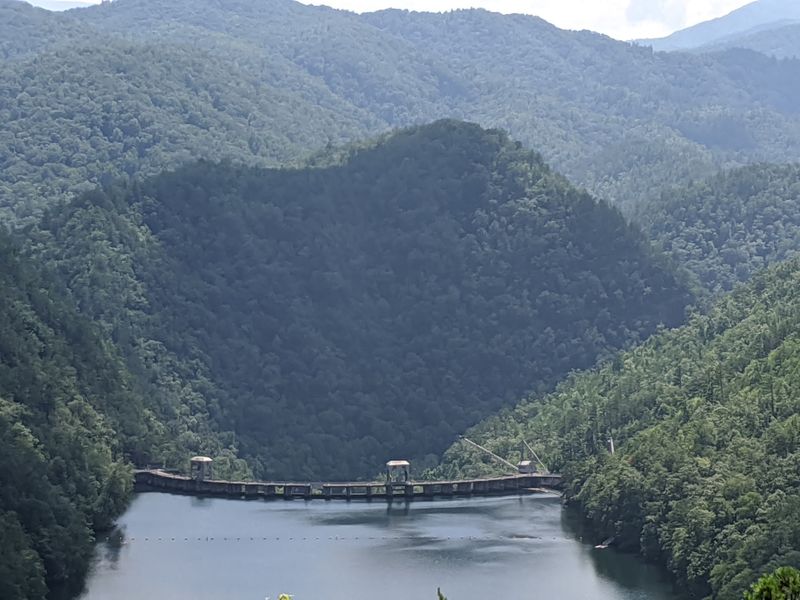More Than 10,000 Acres Of Mountain Water Stretch Out Behind It