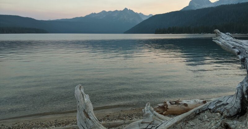 Deep In Idaho’s Sawtooths Sits A Lake Where The Peaks Reflect Perfectly At Dawn