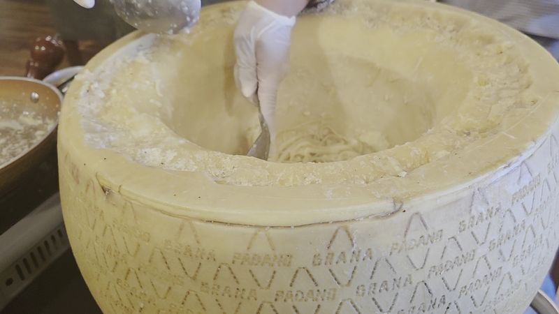 This Georgia Italian Restaurant Turns Into A Magical Alpine Christmas Village Every Winter - Decor Hint Pasta Gets A Spin Inside A Giant Wheel Of Cheese