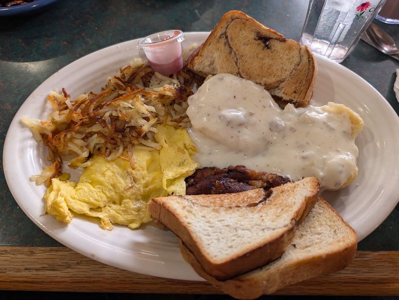 The Cinnamon Rolls At This Michigan Cafe Are So Massive They Barely Fit On The Plate - Decor Hint Fresh Bread Still Matters Here