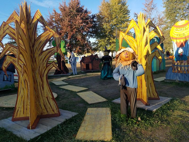 Hayrides Pass Beneath Giant Spiderwebs And Gourd Vines