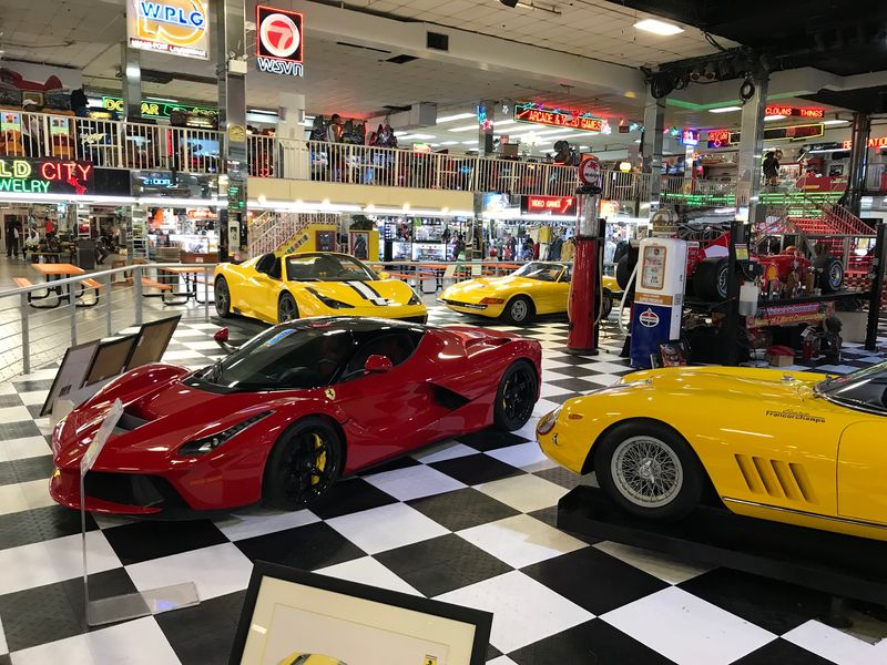 Red Ferraris in the Middle of a Flea Market