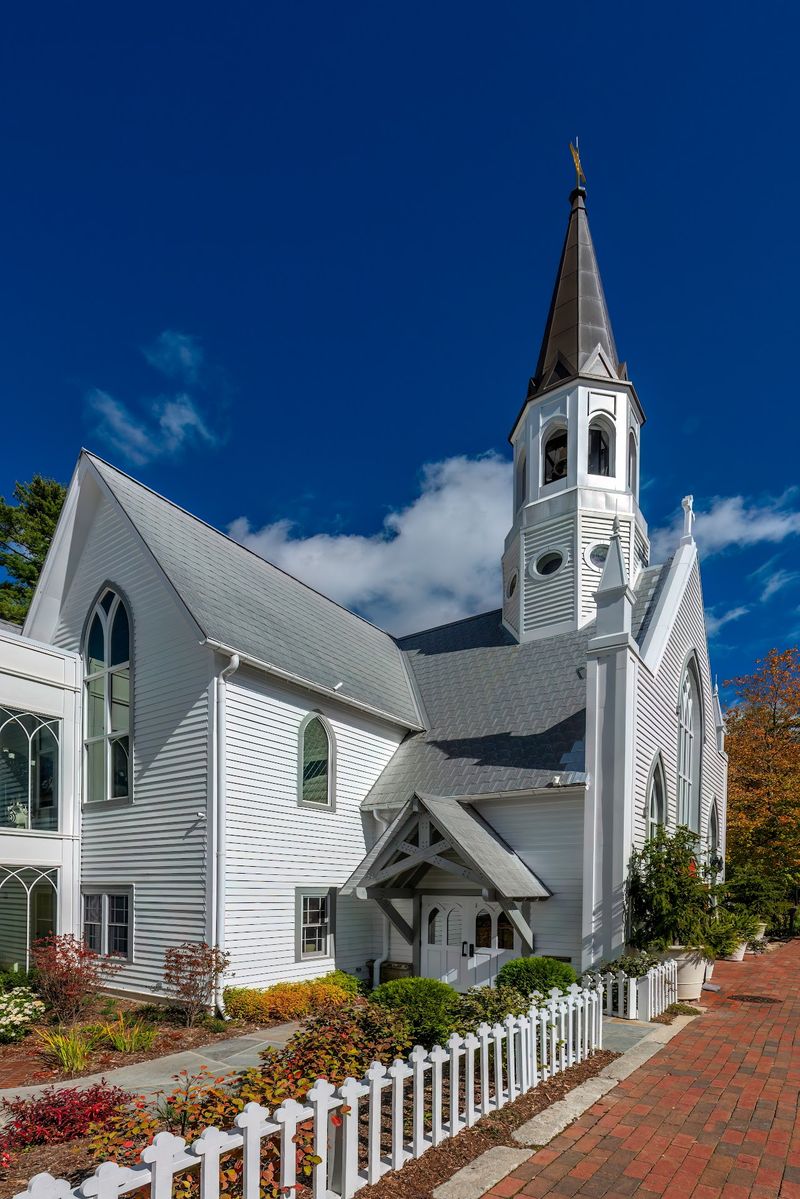 The White Picket Fence Makes The Historic Chapel Look Almost Frozen In Time