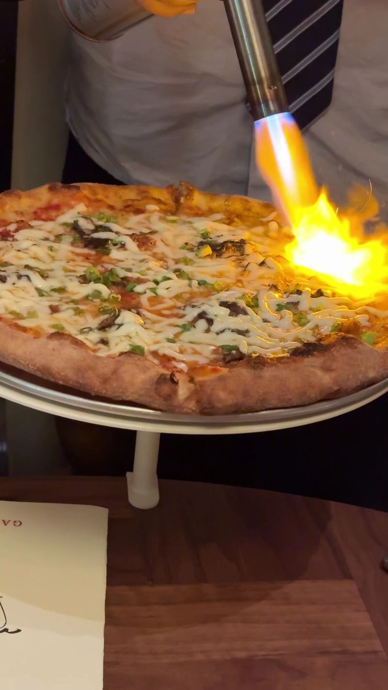 The Bulgogi And Kimchi Pizza Gets Torched Right At Your Table