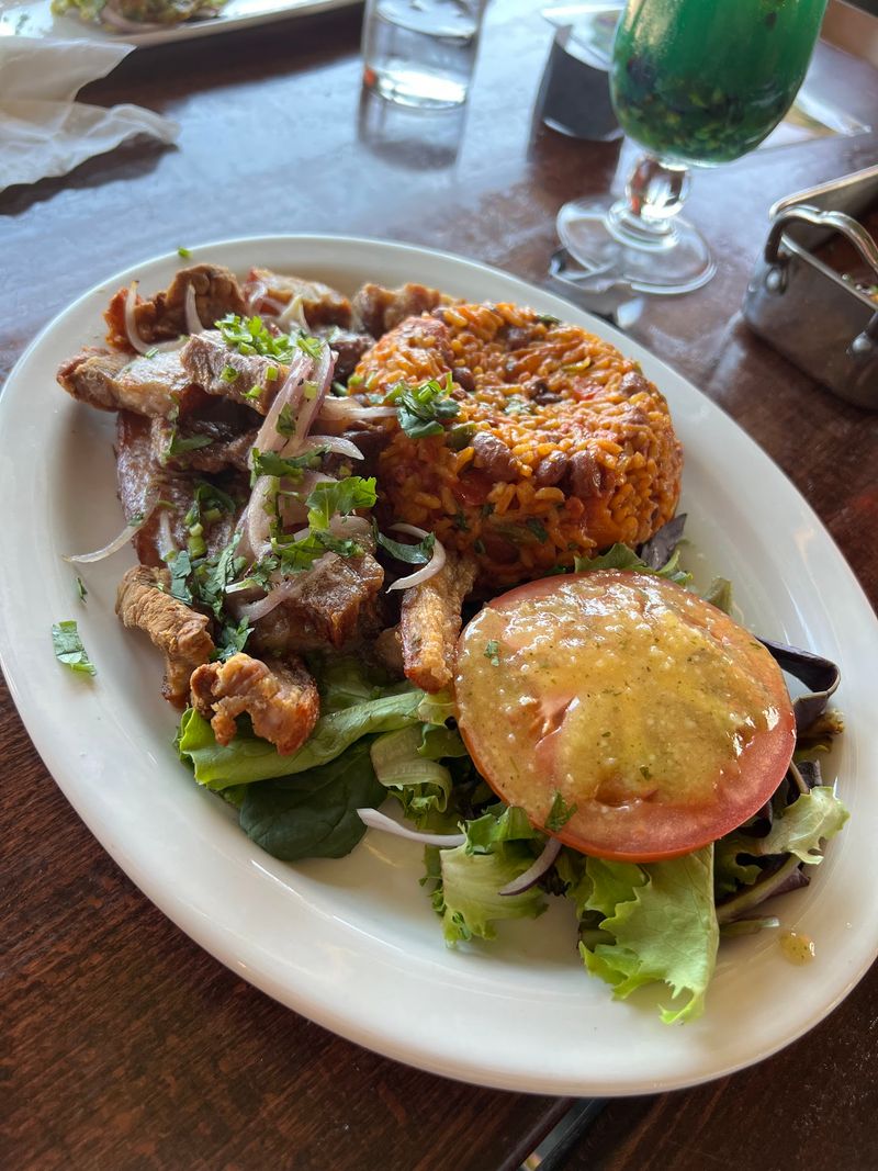 This Nebraska Puerto Rican Kitchen Serves Baked Pernil Alongside Arroz Mamposteao And Tostones - Decor Hint Elie and Her Family Sazón