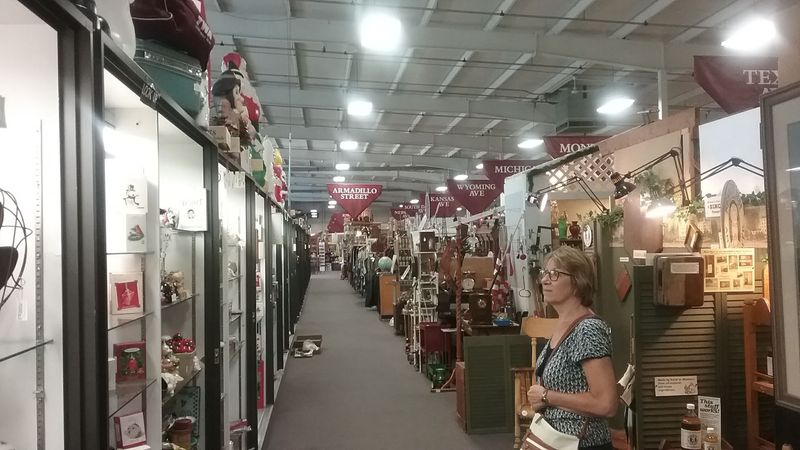 This Enormous Nebraska Antique Mall Fills Endless Aisles With Hundreds Of Dealer Booths Every Day - Decor Hint Street Signs Hanging Over The Aisles