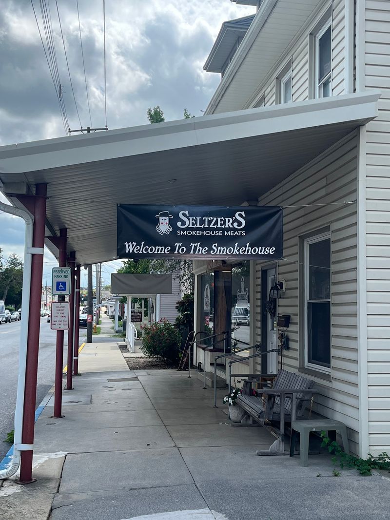 A Smokehouse Store Sitting Right Beside the Railroad Tracks