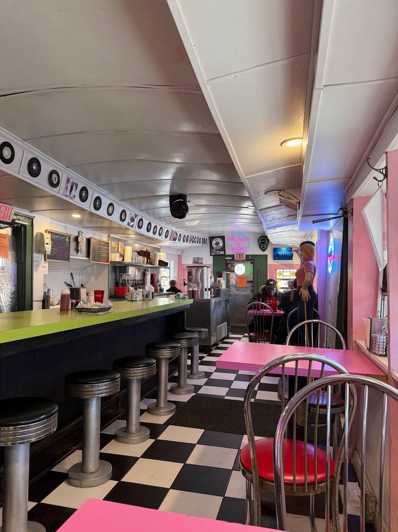 Florida's Oldest Diner Serves Its Famous Milkshake Out Of A 1932 Rail Car - Decor Hint Pink Tables, Green Stools, And A Ringing Bell