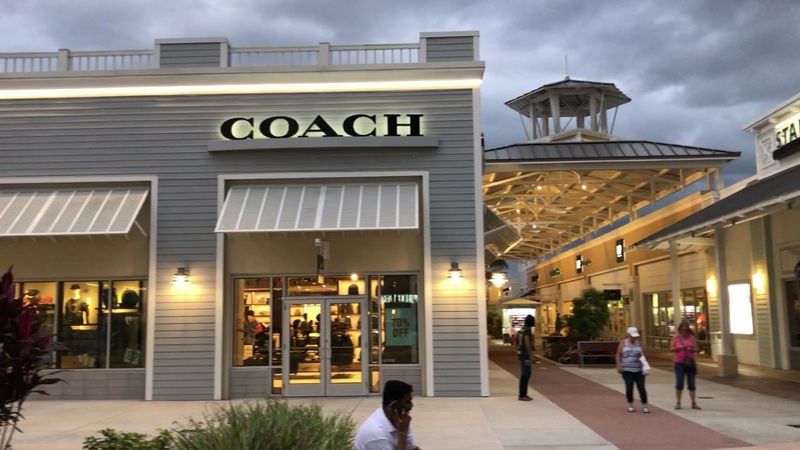 This Florida Outlet Mall Gets Your Steps In While You Hunt Brand-Name Deals, Drink In Hand - Decor Hint A Who's Who Of Familiar Labels