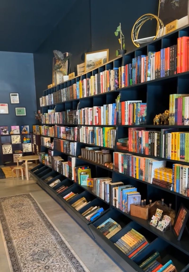 This Nebraska Bookstore Opens Its Garage Door On Nice Days So Readers Linger Over Coffee Until 10 PM - Decor Hint Small Shelves That Punch Well Above Their Size