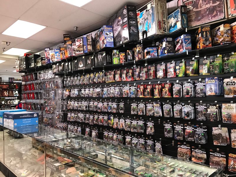 Star Wars Galore And A Wall Of Action Figures