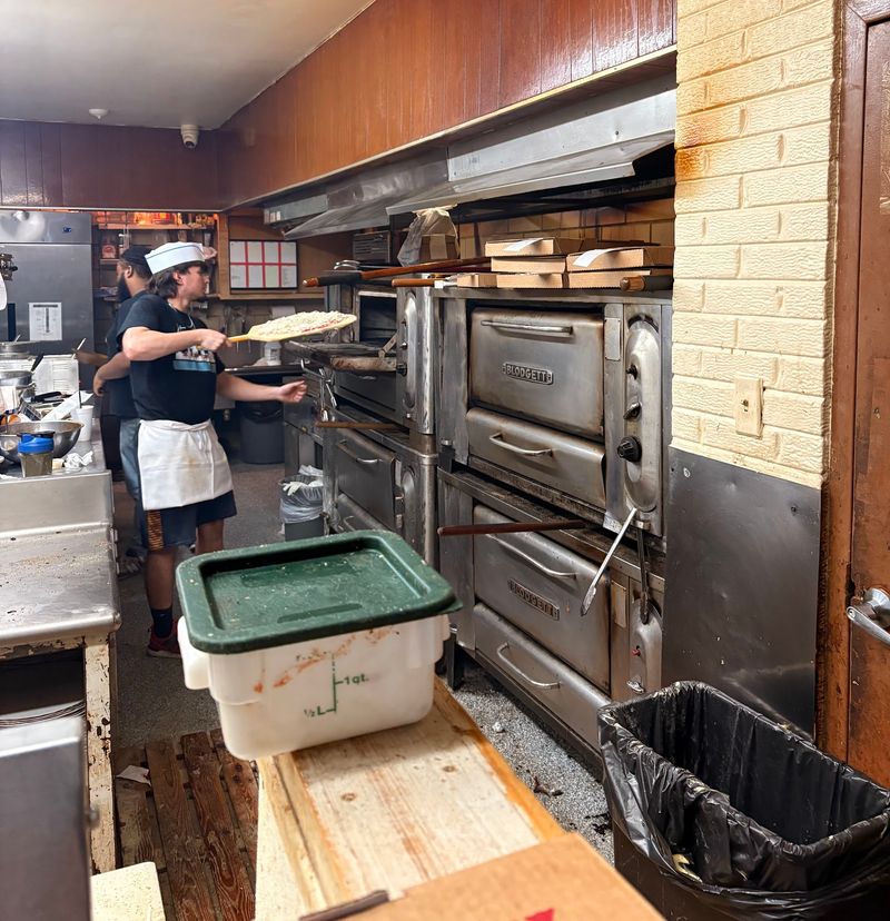 An Illinois Pizzeria Serves Cracker-Thin Tavern Squares So Crispy Locals Fight For The Corner Pieces - Decor Hint No Delivery Driver Will Bring This Pizza To Your Door