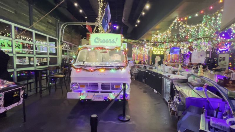 A Vintage Van Works The Bar, And Garage Doors Let The Air In